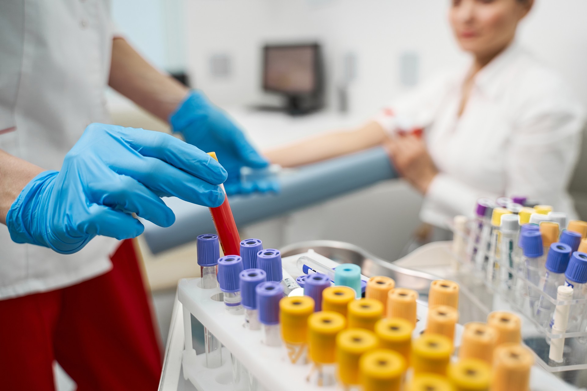 Competent researcher putting test tube in holder